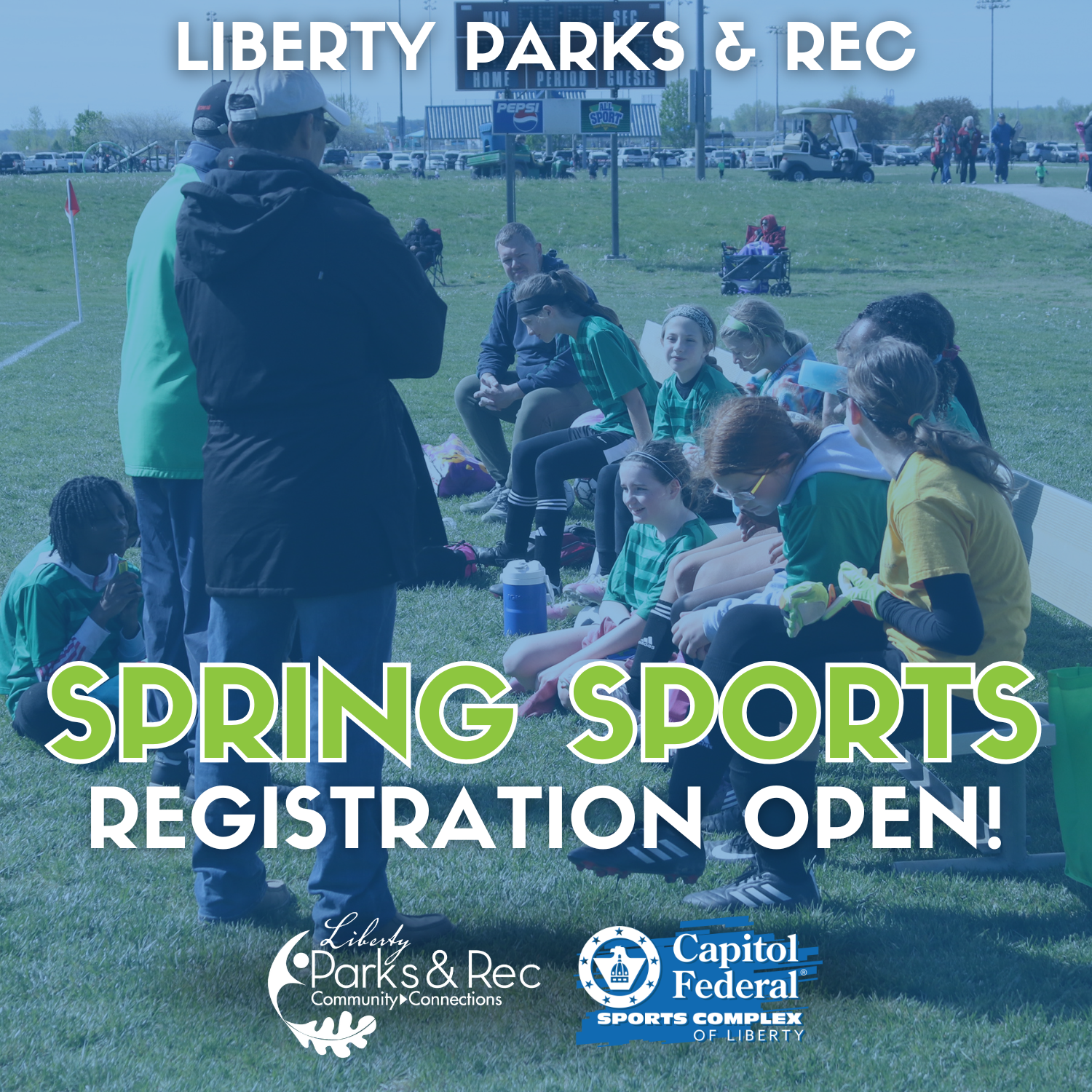 Soccer team on bench, coaches talking