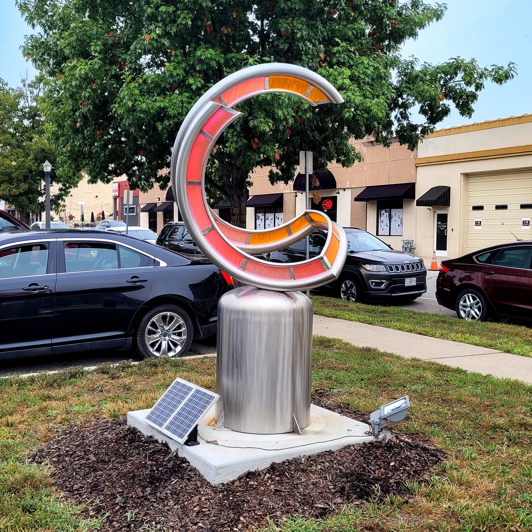 Photo of a sculpture named \"Allura\" on the corner of Kansas and Leonard Streets